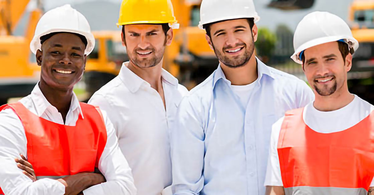 An image of four contractors smiling at the camera