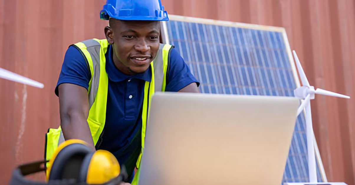 Image of a contractor looking at a laptop