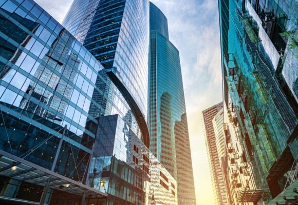 Image of glittering corporate buildings in the sunrise