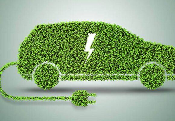 Image of an electric vehicle outline made of green leaves