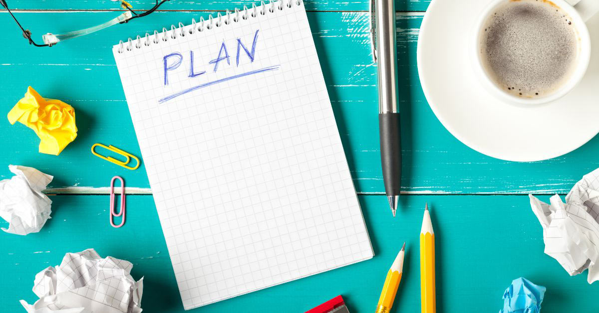 Image of a desk full of planning elements