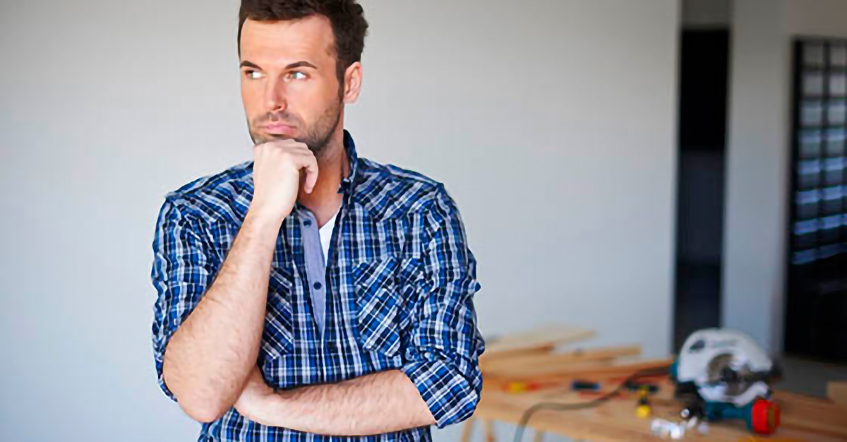 Image of a contractor pondering his business credit
