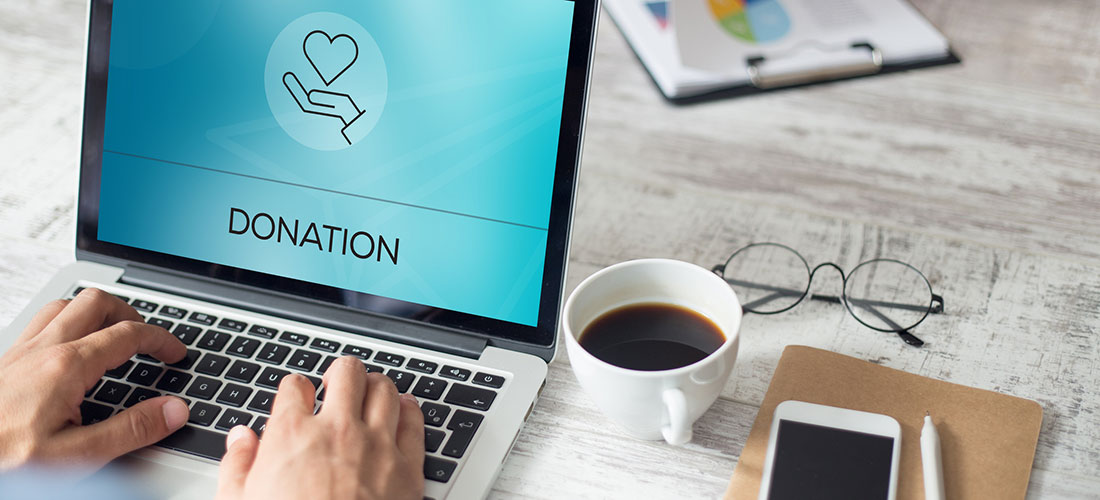 Image of a person making an online donation to a charitable organization