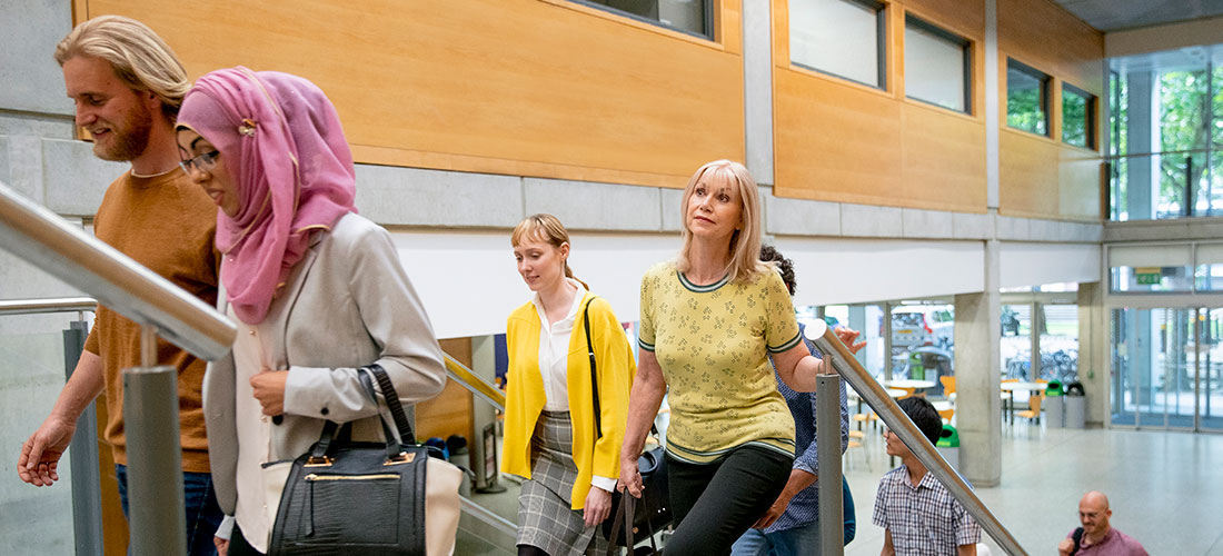 Photo of employees walking into their office