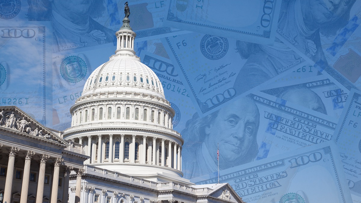 Photo of the building of the United States Congress with faded background of 100 dollar bills.