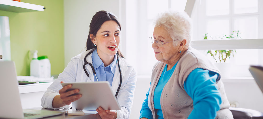 Photo of doctor at independent practice consulting with patient