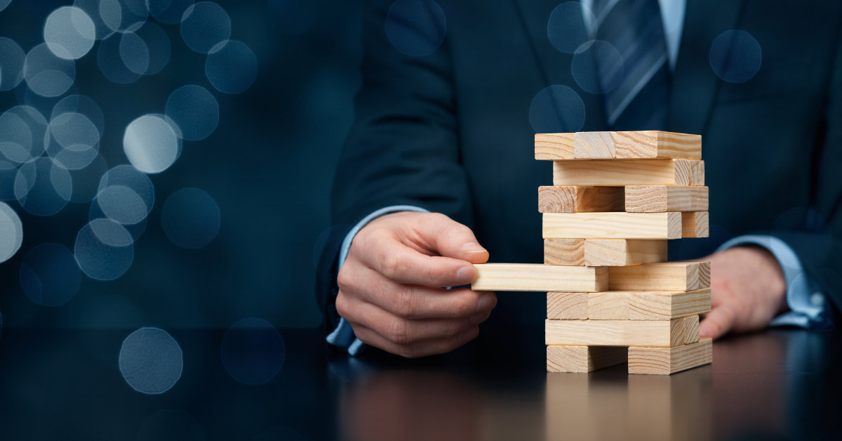 Image of a man playing Jenga