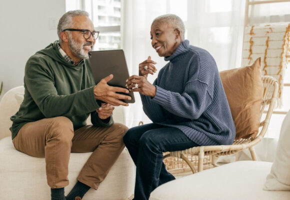 Image of a retired couple looking at an iPad