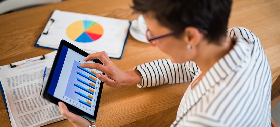 Photo of nonprofit executive director looking at Key Performance Indicators report