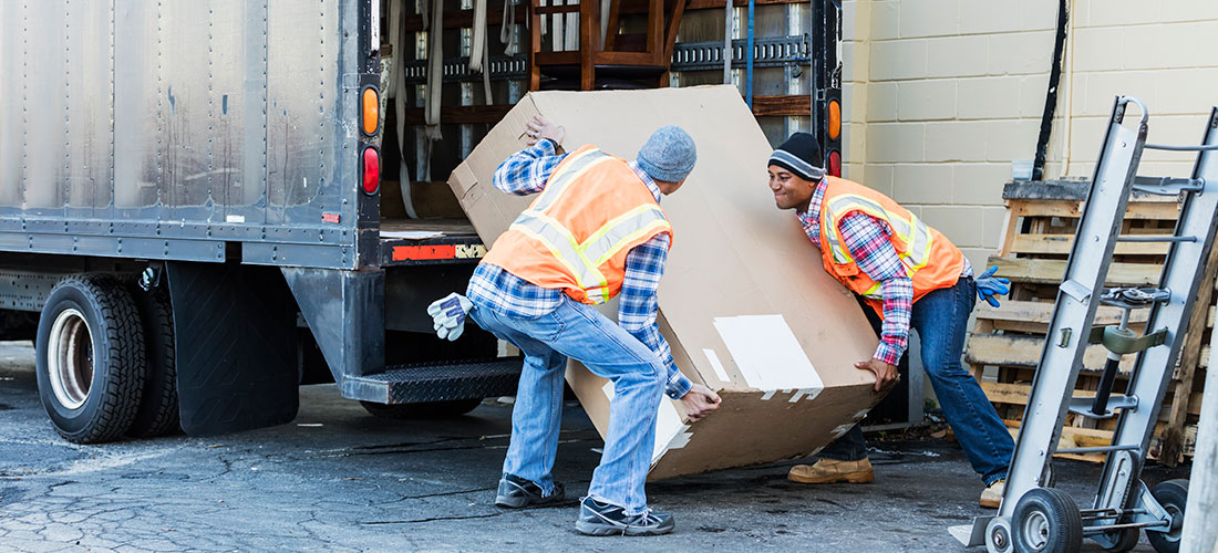 Photo of nonprofit volunteers unloading non cash donations from truck
